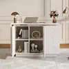 A white desk with a laptop, lamp, and decorative items on top, and shelves with books and decor inside. Podgląd zdjęcia produktu