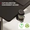 A close-up view of a desk with a cup holder attached to the side, holding a disposable coffee cup. There are also certification logos at the bottom right. Voir les images du produit