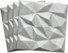 A stack of four 3D wall panels with a geometric, faceted design. Anteprima dell’immagine prodotto