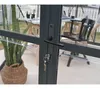 Close-up of a greenhouse door lock and handle, with a plant in a basket visible through the glass. Produktbild-Vorschau