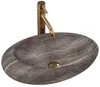 A stone basin with a gold faucet against a white background. Produktbild-Vorschau