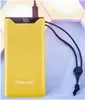 A yellow power bank with a black lanyard is shown against a light gray and white background. Voir les images du produit