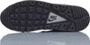 The underside of a black Nike sneaker. Voir les images du produit