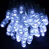 A close-up view of a string of cold white LED lights against a black background. Produktbild-Vorschau