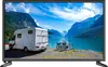 A motorhome parked by a lake with mountains in the background and two bicycles in the foreground. Voir les images du produit