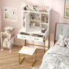 A vanity set with a stool and a rolling cart in a bedroom setting. Náhľad obrázku produktu