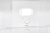 Interior of a white refrigerator with a control knob and light. Produktbild-Vorschau