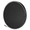 A black circular honeycomb grid reflector with a silver rim, shown from a diagonal angle against a white background. Podgląd zdjęcia produktu