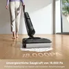 A person is using a cordless wet and dry vacuum cleaner on a wooden floor, with text overlay indicating its suction power. Produktbild-Vorschau