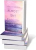 A stack of books with a book cover featuring a sunset over the ocean. Produktbild-Vorschau