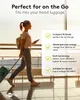 A woman walking through an airport terminal with luggage, with marketing text and icons overlaid. Podgląd zdjęcia produktu
