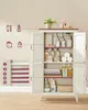 A vintage-style cabinet with its doors open, displaying various toiletries and towels organized on shelves. Icons on the left illustrate common bathroom items like toothpaste, a soap dispenser, and toilet paper. Náhled obrázku produktu