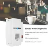 A water dispenser is shown in front of an espresso machine. Náhled obrázku produktu