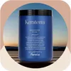 A blue jar of hair mask is placed on a wooden surface with a sunset sky in the background. Podgląd zdjęcia produktu
