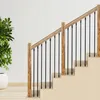 A staircase railing with wooden posts and black metal spindles. Náhľad obrázku produktu