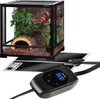 A terrarium with plants and a heating mat with a thermostat. Voir les images du produit