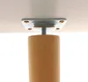 Close-up of the top of a wooden table leg attached to a metal mounting plate. Podgląd zdjęcia produktu