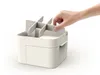 A hand is shown adjusting the dividers in a cosmetic organizer. Náhled obrázku produktu
