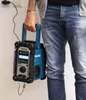 A person holding a Makita radio. Anteprima dell’immagine prodotto