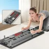 A woman is using a Pilates device in a bright room. Produktbild-Vorschau