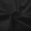 A close-up view of black terry cloth fabric, showing its texture and folds. Náhled obrázku produktu