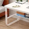 A white computer desk with shelves, placed next to a wooden bed frame. Podgląd zdjęcia produktu