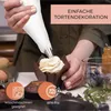 A person is decorating a cupcake with frosting using a piping bag. There are also baking ingredients and accessories visible. Anteprima dell’immagine prodotto