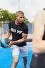 A man is exercising outdoors with a medicine ball. Náhľad obrázku produktu