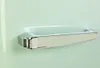A close-up of a refrigerator handle. Produktbild-Vorschau