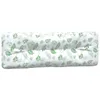 A long, rectangular cushion with a green leaf pattern on a white background. Produktbild-Vorschau