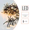 A close-up of a string of warm white LED lights with informational graphics on the right side. Produktbild-Vorschau