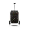 A shopping trolley with a polka dot pattern on a white background. Voir les images du produit