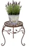 A potted lavender plant sits on a decorative metal plant stand. Produktbild-Vorschau
