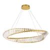 A gold and crystal ring-shaped chandelier. Produktbild-Vorschau