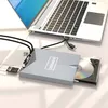 A silver external DVD drive with a USB-C/USB 3.0 connection is shown connected to a laptop. A CD is partially inserted into the drive, and an SD card and a USB flash drive are placed nearby. Produktbild-Vorschau