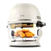 A white air fryer with chicken nuggets inside, shown on a white background. Voir les images du produit