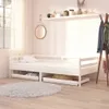 A white wooden daybed with two drawers, shown in a bedroom setting with a rug and a coat rack. Produktbild-Vorschau