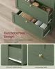 A green bathroom cabinet with drawers open, showing interior details and text overlays. Produktbild-Vorschau