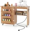 A sewing table with a sewing machine and various sewing supplies. Produktbild-Vorschau