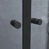 A close-up view of two black handles on a shower door. Produktbild-Vorschau