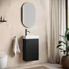 A modern bathroom with a wall-mounted vanity, sink, faucet, mirror, and a toilet. Anteprima dell’immagine prodotto