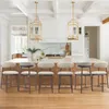 A modern kitchen with a large island and bar stools. Anteprima dell’immagine prodotto