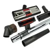 A collection of vacuum cleaner attachments arranged on a white background. Produktbild-Vorschau