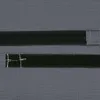 A close-up view of two black velcro straps attached to a gray textured surface. Produktbild-Vorschau