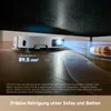 A white robot vacuum cleaner is shown cleaning under a dark piece of furniture, with a blue light beam projecting from it to illustrate its navigation and cleaning path. Text overlays provide information about its minimum height clearance and cleaning capa Produktbild-Vorschau