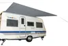 A caravan with an awning extended, shown against a white background. Náhled obrázku produktu