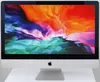 A silver Apple iMac computer with a colorful wallpaper displayed on its screen, placed on a white surface. Produktbild-Vorschau