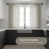 A modern kitchen with a sink and window. Produktbild-Vorschau