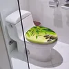 A toilet seat with a bamboo and stone design is placed on a white toilet in a bathroom. Produktbild-Vorschau