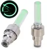 Two green LED valve caps for bicycle tires are shown against a white background. A smaller inset image shows one of the valve caps illuminating a bicycle wheel. Náhľad obrázku produktu